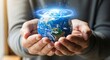 © chehan - Protecting Our World: A pair of hands gently cradles a miniature globe, symbolizing the profound responsibility we share in safeguarding our planet and promoting global unity.