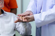 © Washburn - Doctor and nurse supporting happy recovering patient
