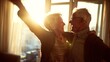 © Marcos Kulenkampff - A happy senior couple shares a joyful moment, laughing and embracing indoors in warm sunlight.