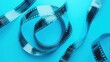 © Jonathan - Twisting film strips with frames appear on a vibrant blue background- highlighting the art and nostalgia of classic filmmaking and traditional cinema