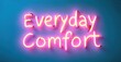 © antishock - Bright pink neon sign displays words Everyday Comfort against vibrant blue background. Simple, modern aesthetic.
