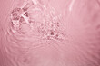 © wacharagorn - Gentle Water Ripples with Soft Pink Background and Elegant Texture