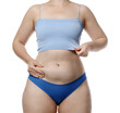 © New Africa - Liposuction. Woman in underwear touching her belly on white background, closeup