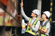 © chokniti - Engineers wearing safety helmets inspecting railway blueprint beside a vintage locomotive, symbolizing teamwork, innovation, and development in modern rail transportation and infrastructure projects