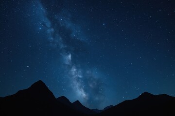 Wall Mural - majestic starry night sky with milky way visible over silhouetted landscape creating cosmic wonder