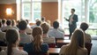 © VistaVisions - Male speaker giving presentation in hall at university workshop. Audience or conference hall. Rear view of unrecognized participants in audience. Scientific conference event, training. Education