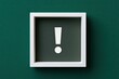 © Pisang - White framed exclamation mark on teal background