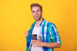 © be free - Warm morning. Coffee break at home. Millennial man having coffee cup isolated on yellow. Morning coffee time. Lifestyle of student. Drinking espresso. Man drinking tea