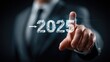 © Collabstonez - Businessman points at 2025