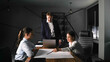 © Sergey - Business meeting in a modern office with focused discussions and planning strategy