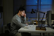 © Stella 16 - Staying late to get it done. Shot of a young businessman using a computer at his desk during a late night at work.
