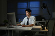 © Stella 16 - Businessman working overtime at his desk late at night