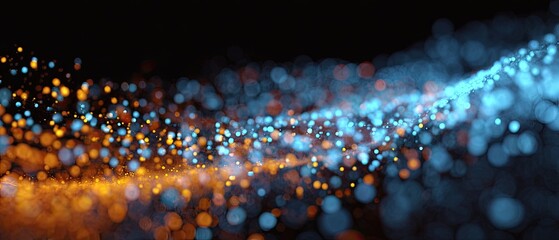 Abstract swirling particles of orange and blue light