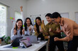 © David - Excited happy, Asian businesspeople and employee giving happy expression after looking in laptop at office.