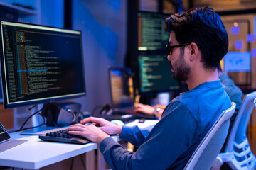 Asian software engineer or programmer team working late in development office,problem solving or algorithm of ai assistant helping for work.software developer,digital technology security concept