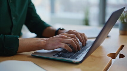 Wall Mural - Businessman hands writing email at laptop in creative agency office closeup. 