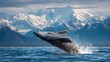 © Mrs. Studio - Humpback Whale Breaching the Ocean Surface Against Snowy Mountain Backdrop
