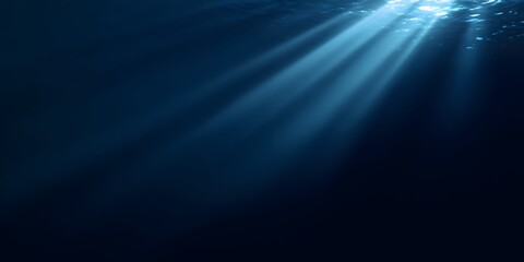 A dark blue background with rays of light shining down, creating an underwater effect. 