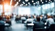 © Arifah - Blurred view of a large conference hall filled with attendees