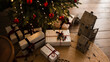 © morrowlight - Christmas gift boxes on wooden floor under xmas tree at home. Winter holiday season.