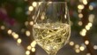 © Jojo* - A sparkling glass of celebratory bubbly, bathed in warm, golden light, showcases festive cheer.