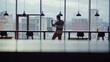 © stockbusters - Overjoyed businessman looking laptop reacting great news at cityscape interior