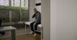 © Marco - Distressed man alone in medical room, seated on exam table holding neck, showing signs of discomfort or emotional fatigue after healthcare consultation