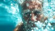 © Denis - Elderly Man Swimming in Clear Blue Ocean Water with Focused Expression and Light Splashing Waves