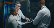 © peopleimages.com - Server room, network and manager with people on tablet for cybersecurity, diagnostics test and maintenance. IT team, meeting and workers with boss for system, online database and technical support