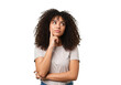 © Ms Vector - Young woman with curly hair thinking and looking to the side, isolated on transparent background