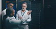 © peopleimages.com - Collaboration, conversation and tablet with people in server room for network administration. Communication, cybersecurity and tech support with team in data center for maintenance of mainframe