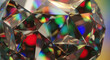 © DWI - Close-up view of a multifaceted, reflective sphere showcasing a vibrant array of colors refracted through its intricate facets.