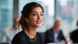 © Neha - young indian woman presenting project in meeting at modern office