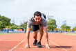 © Kawee - Caucasian young man athlete running exercise on a track at the stadium.
