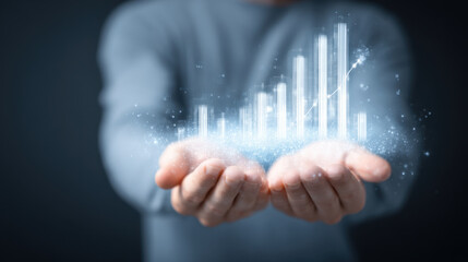 Wall Mural - hands holding glowing data visualization with bar graphs and sparkles, representing growth and analy