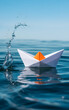 © Khorshed - Paper boat sails through splashing water on a clear day