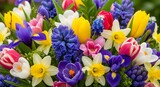 A vibrant and colorful bouquet of spring flowers, including tulips, hyacinths, daffodils, and crocuses