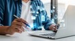 © Png stock - A person uses a pen to interact with a digital interface displaying data and charts on a laptop