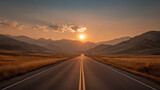 夕焼け空で直線道路と山並みが続く静かな風景