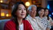 © pkproject - Asian family enjoying a cozy evening together in their living room.