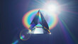 © Rully J - Prism Refracting Light with Rainbow Colors Against Dark Blue Background