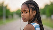© Olga - Teenage girl with braided hair looking upset