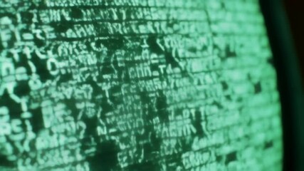 Green monitor displays computer code background abstract pattern