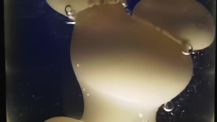 Abstract white objects in liquid with bubbles