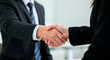 © Leo - A close-up of a handshake between two business people