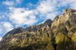 © ADDICTIVE STOCK - Airplane flying over rocky mountains in Milford Sound