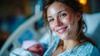 © Aliaksandra - Smiling mother in a hospital bed holding her newborn baby in a tender moment