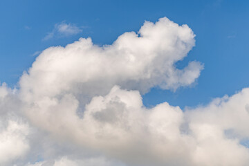 Wall Mural - Cloudscape sky background. Cloud in the sky. Background with cloud. Gloomy sky with overcast clouds. Skyscape and cloudscape. Radiant sky with clouds. Cloudy skyscape background