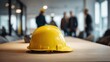 © Wandrian - Yellow safety helmet on conference table