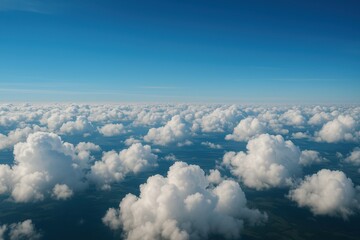 Wall Mural - Skyward Symphony: An expansive view of a bright blue sky is adorned with a multitude of puffy, white clouds, painted with varying shades of blue, evokes a sense of serenity and boundless potential. 